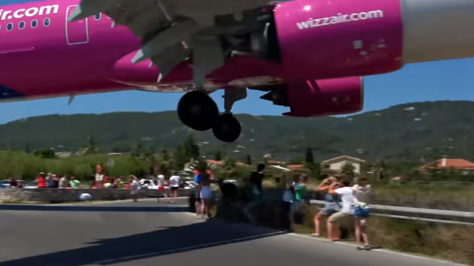 Tourists duck as plane makes extremely low landing on Greek island of Skiathos | World News