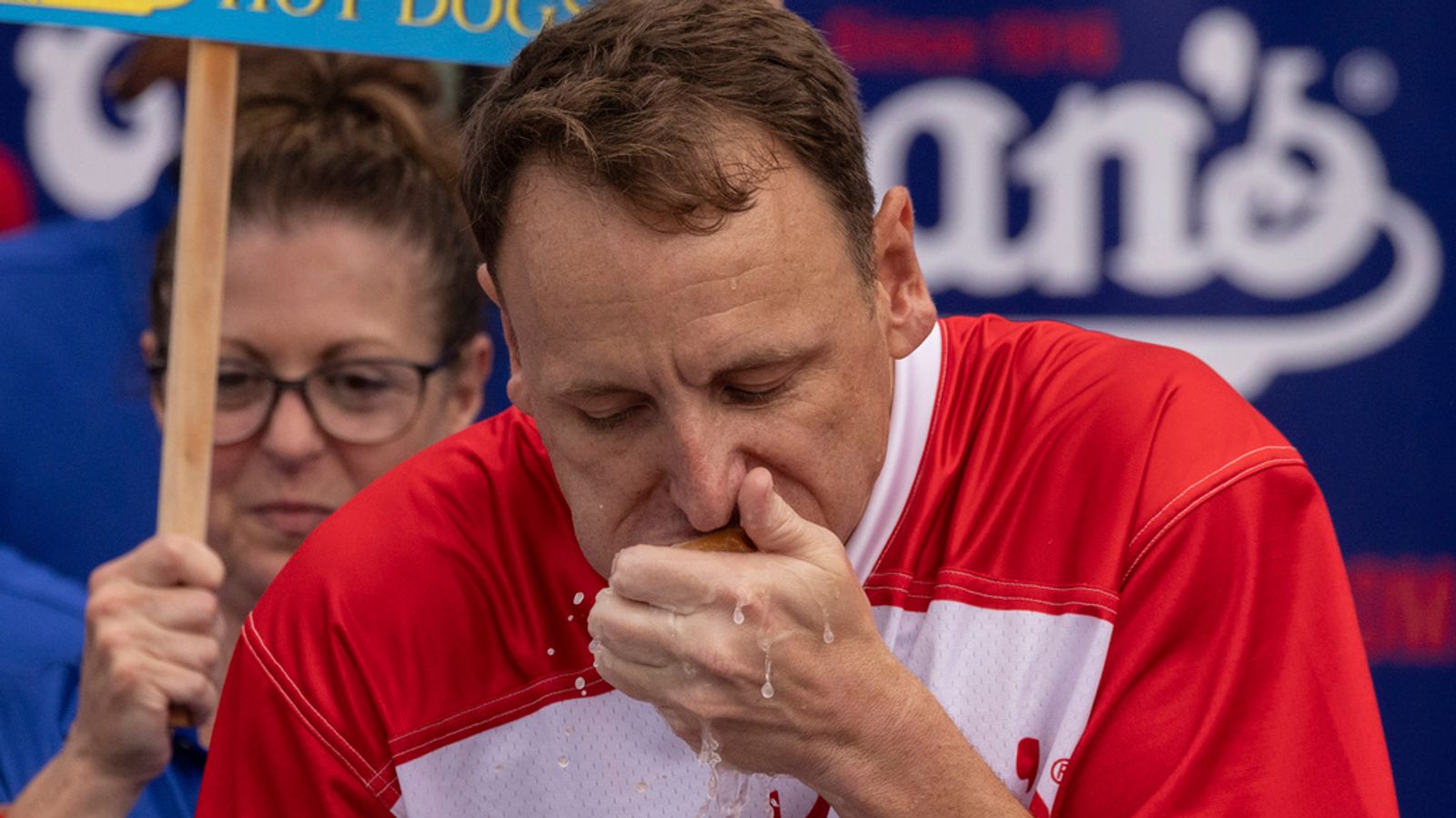 Joey Chestnut eats a hot dog as he competes for his 16th championship title during the 2023 Nathan's Famous Fourth of July hot dog eating contest in the Coney Island section of the Brooklyn borough of New York, Tuesday, July. 4, 2023. (AP Photo/Yuki Iwamura)